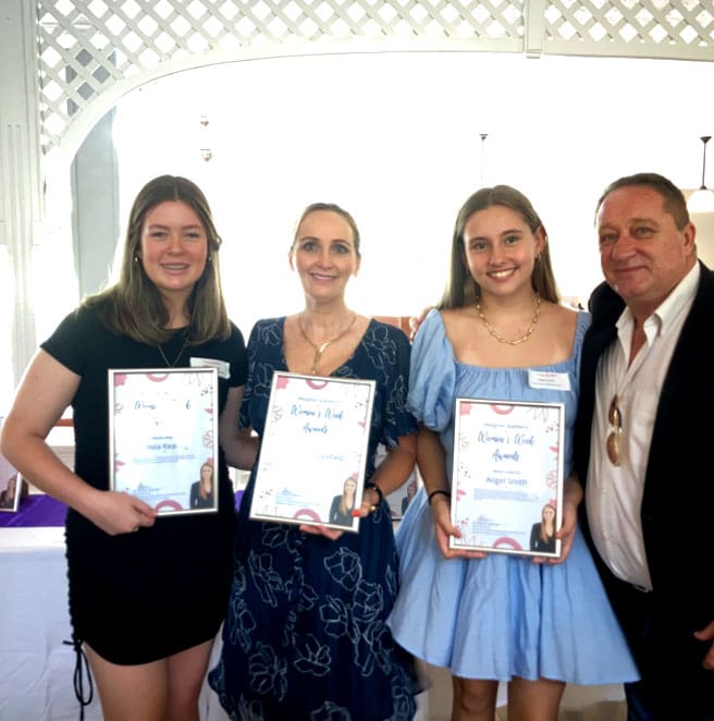 Receiving an award for her outstanding volunteer efforts in helping women and children.